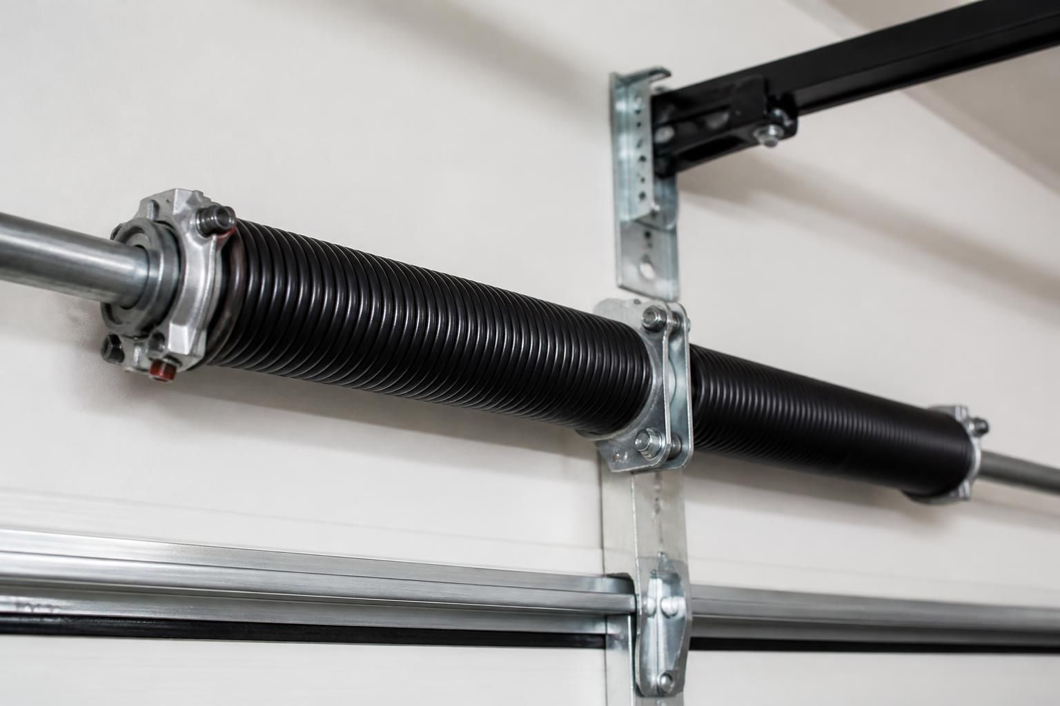 Professionally restored garage door springs in a clean service environment